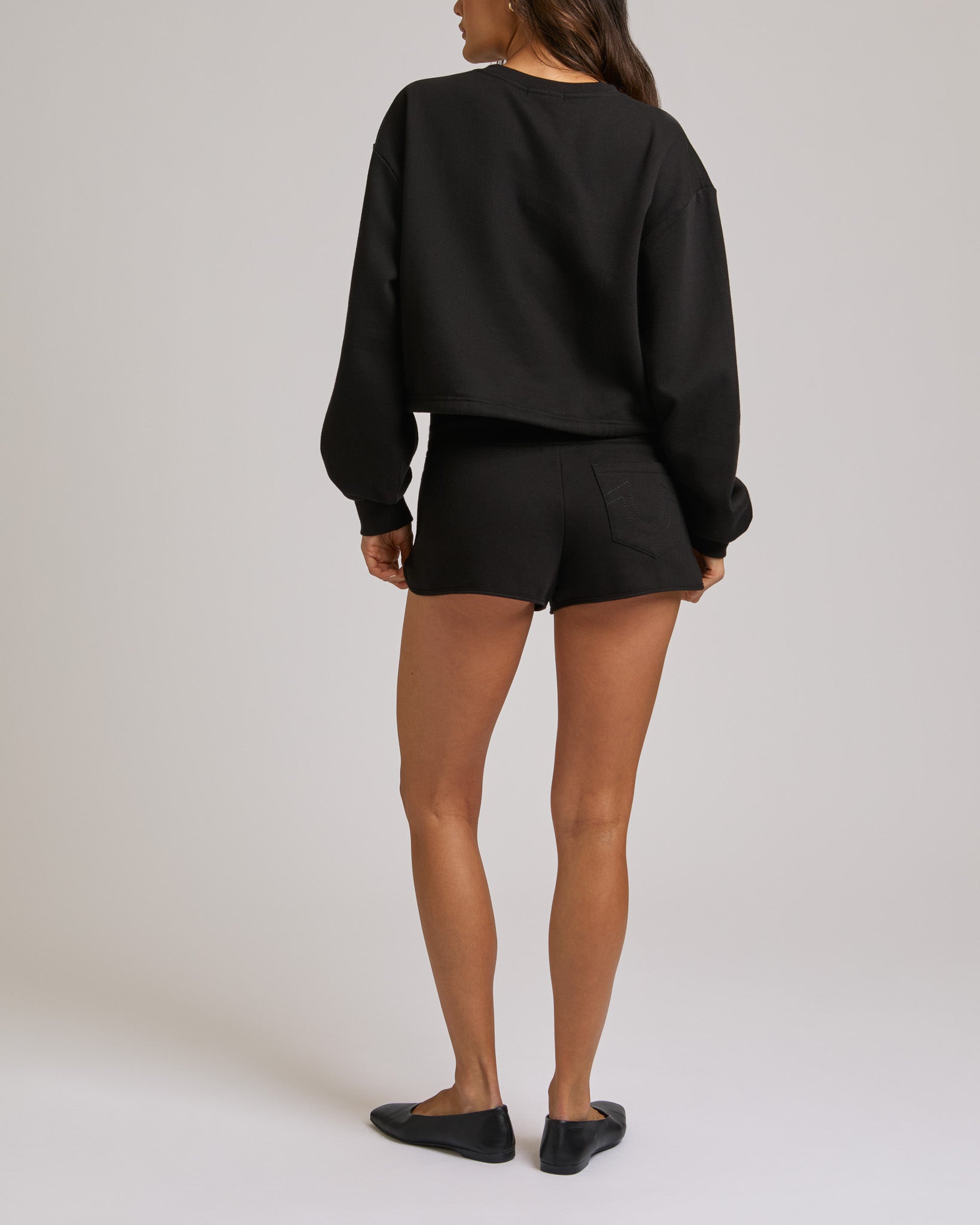 ZIP PKT DOLPHIN HEM HOT SHORTS - JET BLACK
