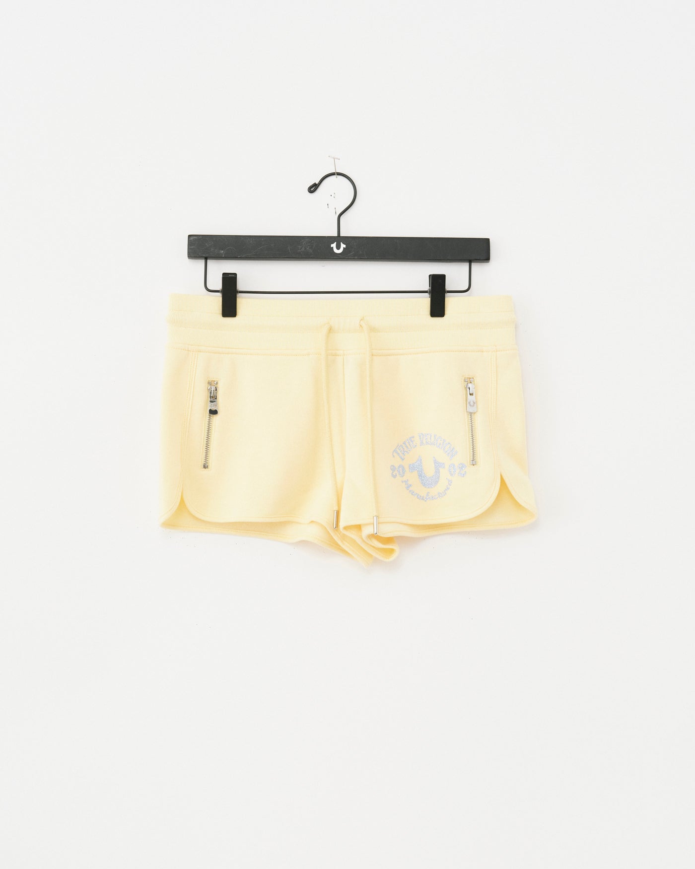 ZIP PKT DOLPHIN HEM HOT SHORTS - DOUBLE CREAM