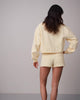 ZIP PKT DOLPHIN HEM HOT SHORTS - DOUBLE CREAM